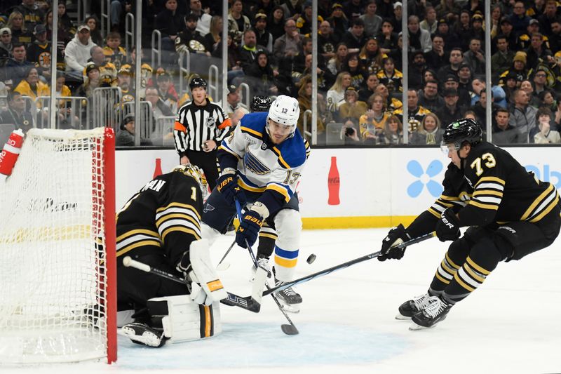 Mar 11, 2024; Boston, Massachusetts, USA; Boston Bruins goaltender Jeremy Swayman (1) makes a save on St. Louis Blues right wing Alexey Toropchenko (13) while Boston Bruins defenseman Charlie McAvoy (73) defends during the second period at TD Garden. Mandatory Credit: Bob DeChiara-USA TODAY Sports