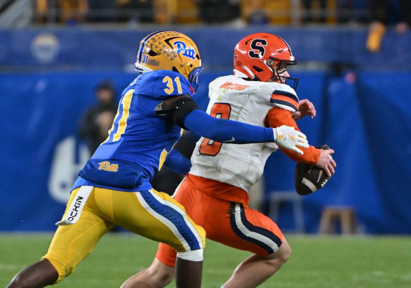 Oct 24, 2024; Pittsburgh, Pennsylvania, USA; Pittsburgh Panthers linebacker Rasheem Biles (31) sacks Syracuse Orange quarterback Kyle McCord (6) during the second quarter at Acrisure Stadium. Mandatory Credit: Barry Reeger-Imagn Images