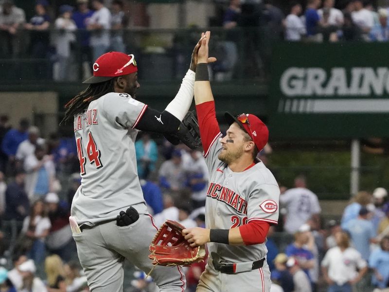 May 30, 2025; Chicago, Illinois, USA; Cincinnati Reds shortstop Elly De La Cruz (44) and outfielder TJ Friedl (29) celebrate their win against the Chicago Cubs at Wrigley Field. Mandatory Credit: David Banks-Imagn Images