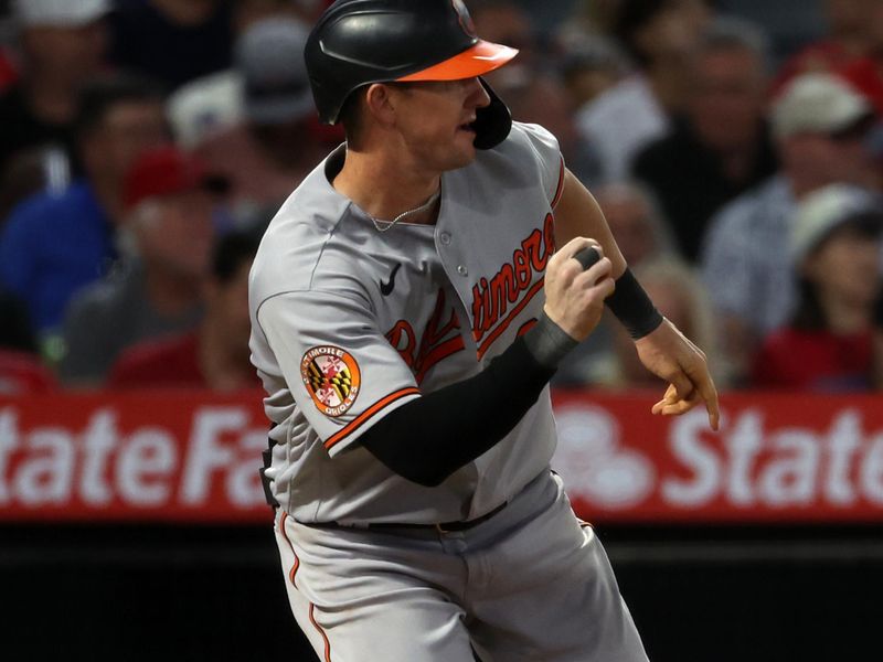 Sep 6, 2023; Anaheim, California, USA;  Baltimore Orioles left fielder Austin Hays (21) hits an RBI single during the third inning against the Los Angeles Angels at Angel Stadium. Mandatory Credit: Kiyoshi Mio-USA TODAY Sports