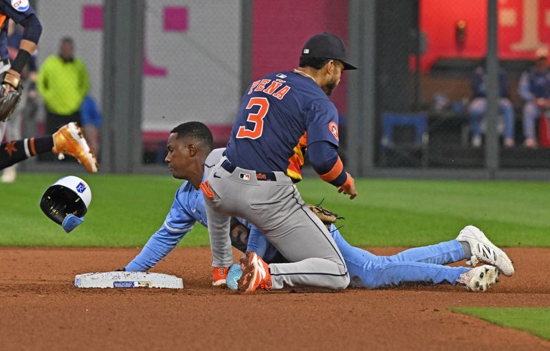 Apr 26, 2025; Kansas City, Missouri, USA;  Kansas City Royals second baseman Tyler Tolbert (2) steals second base against Houston Astros shortstop Jeremy Pena (3) in the seventh inning at Kauffman Stadium. Mandatory Credit: Peter Aiken-Imagn Images