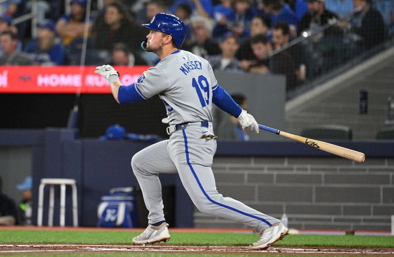 Apr 30, 2024; Toronto, Ontario, CAN;   Kansas City Royals second baseman Michael Massey (19) hits a two-run home run against the Toronto Blue Jays in the second inning at Rogers Centre. Mandatory Credit: Dan Hamilton-USA TODAY Sports