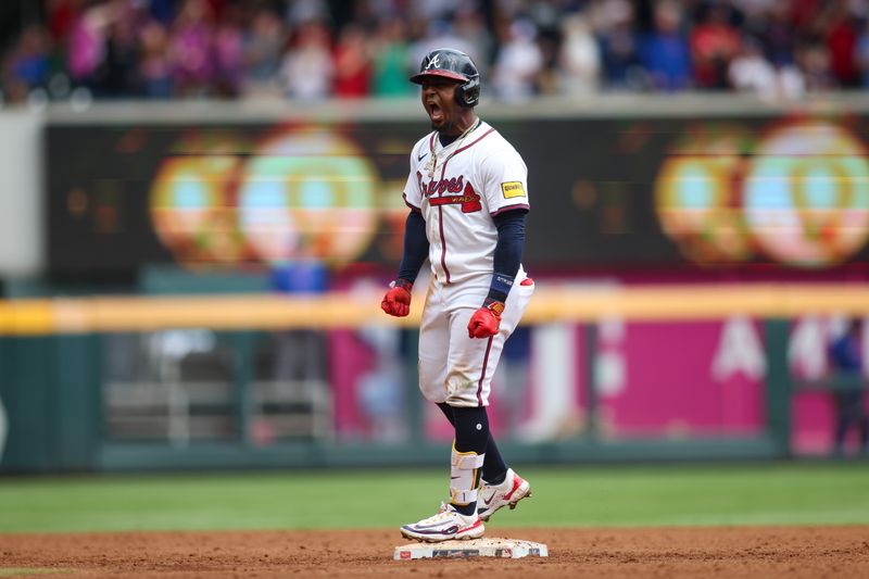 Sep 30, 2024; Atlanta, Georgia, USA; Atlanta Braves second baseman Ozzie Albies (1) celebrates after a three-run double against the New York Mets in the eighth inning at Truist Park. Mandatory Credit: Brett Davis-Imagn Images
