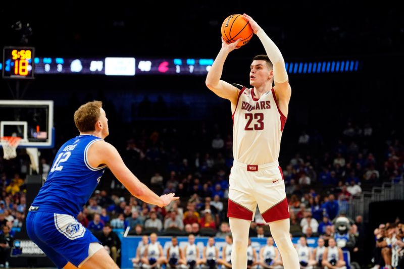 Mar 21, 2024; Omaha, NE, USA; Drake Bulldogs guard Ethan Roberts (23) shoots against Drake Bulldogs guard Tucker DeVries (12) in the second half in the first round of the 2024 NCAA Tournament at CHI Health Center Omaha. Mandatory Credit: Dylan Widger-USA TODAY Sports