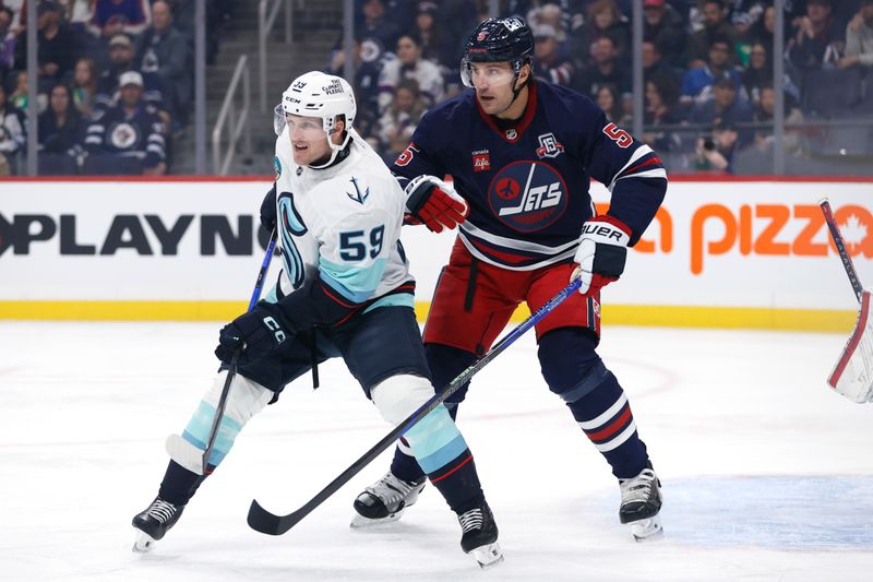 Oct 23, 2025; Winnipeg, Manitoba, CAN; Seattle Kraken Ben Meyers (59) and Winnipeg Jets defenseman Luke Schenn (5) watch for an incoming shot in the first period at Canada Life Centre. Mandatory Credit: James Carey Lauder-Imagn Images