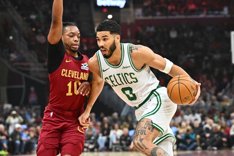 CLEVELAND, OHIO - DECEMBER 01: Darius Garland #10 of the Cleveland Cavaliers guards Jayson Tatum #0 of the Boston Celtics during the first quarter at Rocket Mortgage Fieldhouse on December 01, 2024 in Cleveland, Ohio. NOTE TO USER: User expressly acknowledges and agrees that, by downloading and or using this photograph, User is consenting to the terms and conditions of the Getty Images License Agreement. (Photo by Jason Miller/Getty Images)