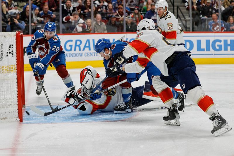 Jan 6, 2024; Denver, Colorado, USA; Florida Panthers goaltender Sergei Bobrovsky (72) reaches back for the puck on a shot from defenseman Josh Manson (not pictured) against right wing Logan O'Connor (25) and center Ross Colton (20) as defenseman Brandon Montour (62) defends in the second period at Ball Arena. Mandatory Credit: Isaiah J. Downing-USA TODAY Sports