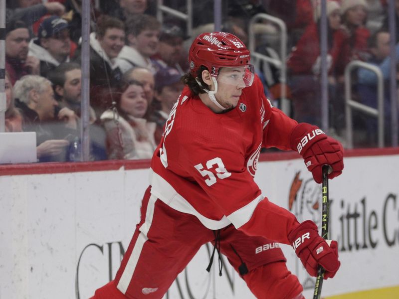 Mar 18, 2023; Detroit, Michigan, USA; Detroit Red Wings defenseman Moritz Seider (53) shoots the puck against the Colorado Avalanche during the third period at Little Caesars Arena. Mandatory Credit: Brian Bradshaw Sevald-USA TODAY Sports