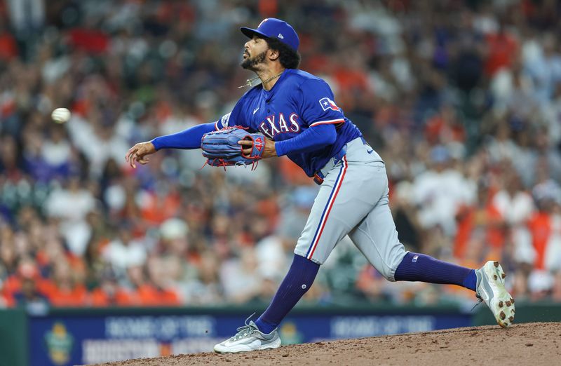 Apr 12, 2024; Houston, Texas, USA; Texas Rangers relief pitcher Grant Anderson (65) delivers a pitch during the seventh inning against the Houston Astros at Minute Maid Park. Mandatory Credit: Troy Taormina-USA TODAY Sports