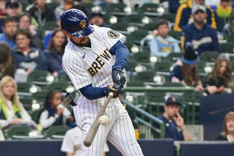 Jun 11, 2023; Milwaukee, Wisconsin, USA; Milwaukee Brewers left fielder Blake Perkins (16) drives in a run with a base hit against the Oakland Athletes in the sixth inning at American Family Field. Mandatory Credit: Benny Sieu-USA TODAY Sports