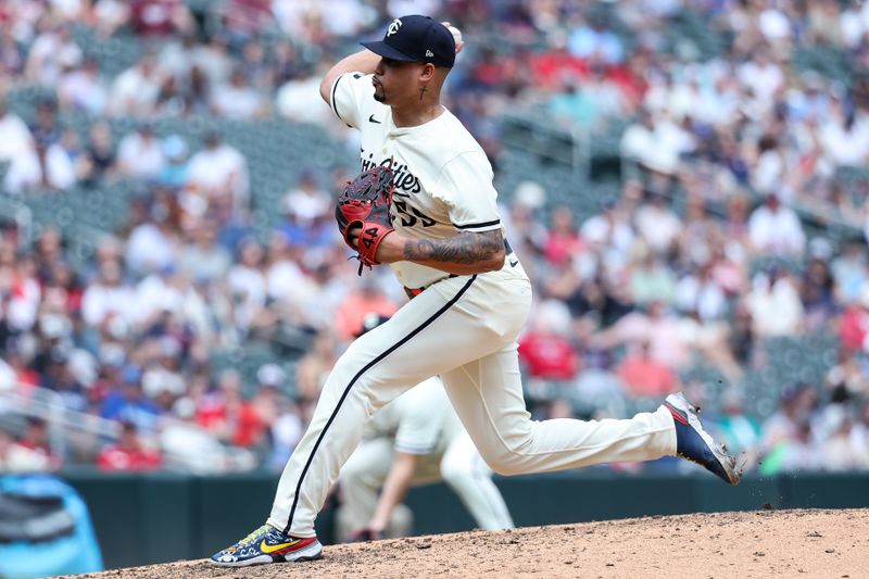 May 25, 2025; Minneapolis, Minnesota, USA; Minnesota Twins pitcher Jhoan Duran (59) delivers a pitch against the Kansas City Royals during the tenth inning at Target Field. Mandatory Credit: Matt Krohn-Imagn Images