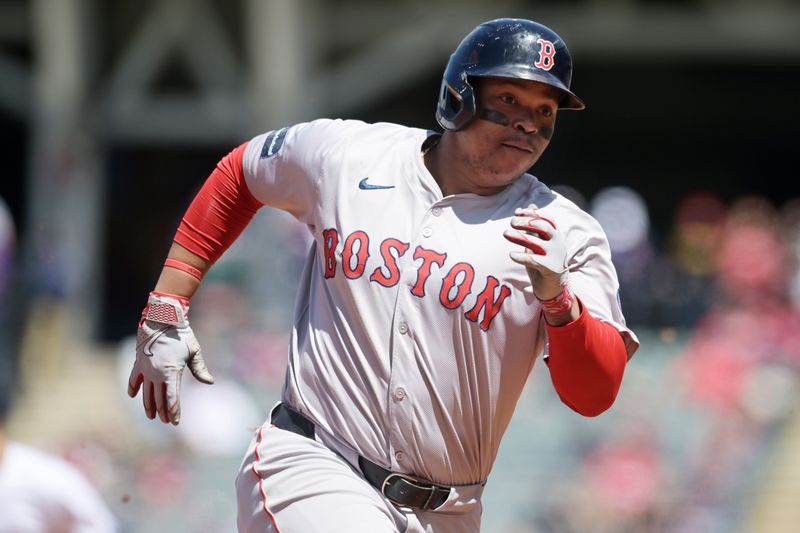 Apr 25, 2024; Cleveland, Ohio, USA; Boston Red Sox designated hitter Rafael Devers (11) rounds third base en route to scoring during the third inning against the Cleveland Guardians at Progressive Field. Mandatory Credit: Ken Blaze-USA TODAY Sports