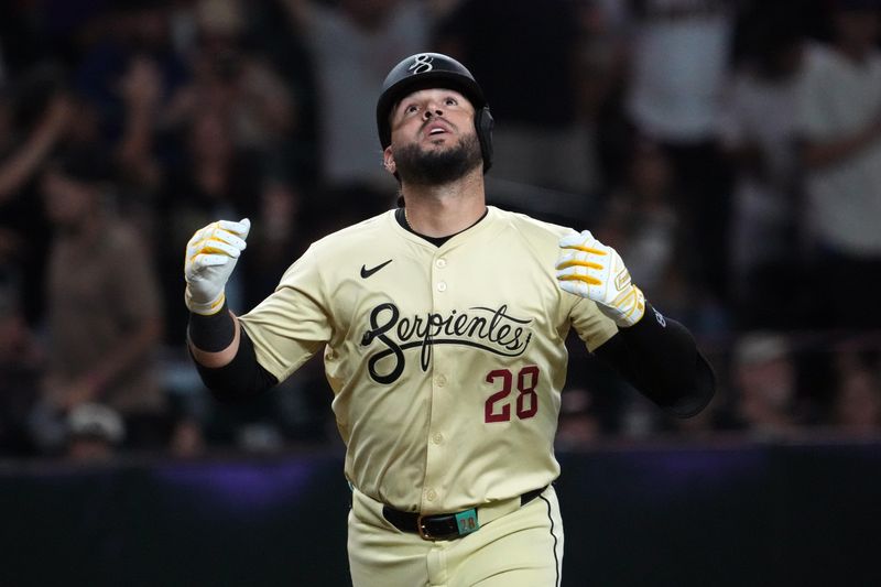 Jul 30, 2024; Phoenix, Arizona, USA; Arizona Diamondbacks third base Eugenio Suárez (28) celebrates after hitting a solo home run against the Washington Nationals during the seventh inning at Chase Field. Mandatory Credit: Joe Camporeale-USA TODAY Sports