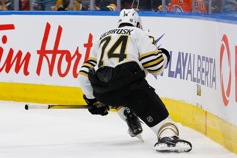 Feb 21, 2024; Edmonton, Alberta, CAN; Boston Bruins forward Jake DeBrusk (74) celebrates his goal scoredduring the second period against the Edmonton Oilers at Rogers Place. Mandatory Credit: Perry Nelson-USA TODAY Sports