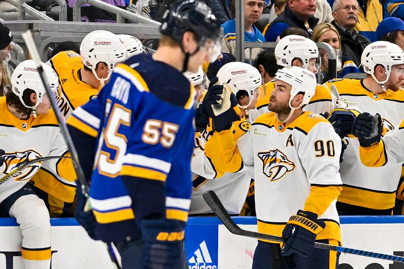 Nov 24, 2023; St. Louis, Missouri, USA;  Nashville Predators center Ryan O'Reilly (90) is congratulated by teammates after scoring against the St. Louis Blues during the second period at Enterprise Center. Mandatory Credit: Jeff Curry-USA TODAY Sports