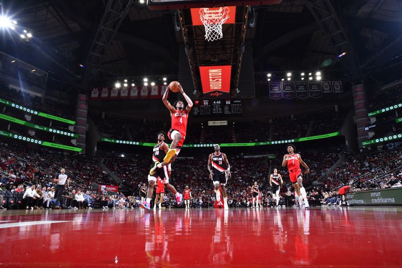 HOUSTON, TX - MARCH 25: Jalen Green #4 of the Houston Rockets drives to the basket during the game against the Portland Trail Blazers on March 25, 2024 at the Toyota Center in Houston, Texas. NOTE TO USER: User expressly acknowledges and agrees that, by downloading and or using this photograph, User is consenting to the terms and conditions of the Getty Images License Agreement. Mandatory Copyright Notice: Copyright 2024 NBAE (Photo by Logan Riely/NBAE via Getty Images)