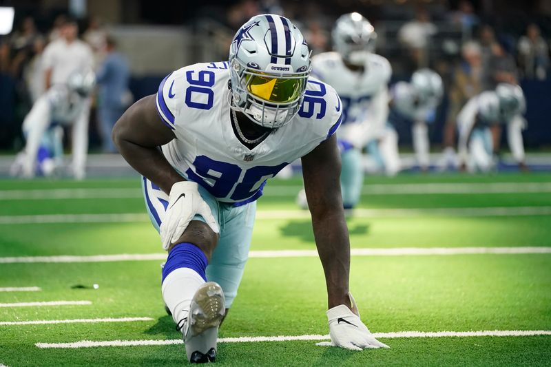 Dallas Cowboys defensive end DeMarcus Lawrence stretches on the field before a preseason NFL football game against the Las Vegas Raiders in Arlington, Texas, Saturday, Aug. 26, 2023. (AP Photo/Sam Hodde)