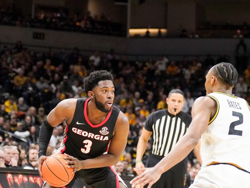 Jan 6, 2024; Columbia, Missouri, USA; Georgia Bulldogs guard Noah Thomasson (3) controls the ball as Missouri Tigers guard Tamar Bates (2) defends during the second half at Mizzou Arena. Mandatory Credit: Denny Medley-USA TODAY Sports