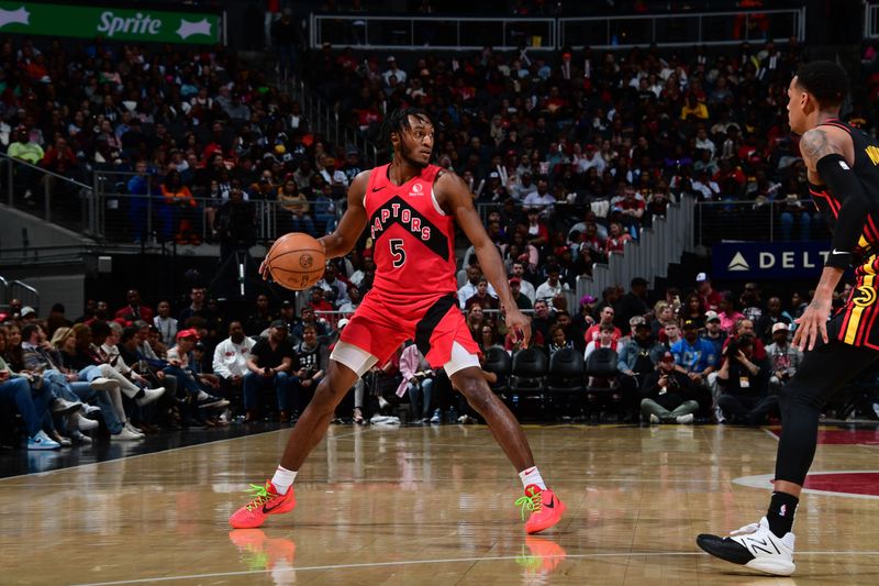 ATLANTA, GA - February 23:   Immanuel Quickley #5 of the Toronto Raptors handles the ball during the game against the Atlanta Hawks on February 23, 2024 at State Farm Arena in Atlanta, Georgia.  NOTE TO USER: User expressly acknowledges and agrees that, by downloading and/or using this Photograph, user is consenting to the terms and conditions of the Getty Images License Agreement. Mandatory Copyright Notice: Copyright 2024 NBAE (Photo by Scott Cunningham/NBAE via Getty Images)