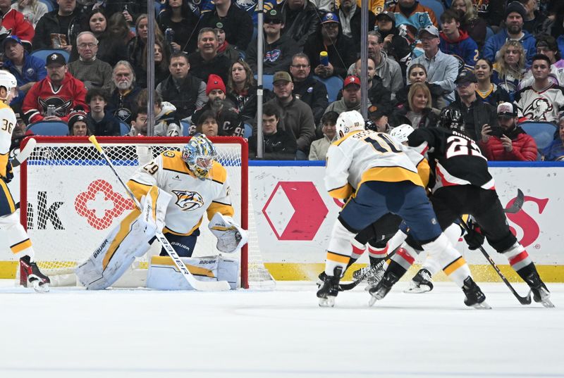 Jan 31, 2025; Buffalo, New York, USA; Nashville Predators goaltender Justus Annunen (29) defends the goal from a threat from Buffalo Sabres right wing Jack Quinn (22) in the first period at the KeyBank Center. Mandatory Credit: Mark Konezny-Imagn Images