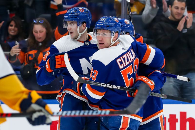 Apr 6, 2024; Elmont, New York, USA; New York Islanders defenseman Noah Dobson (8) celebrates with center Casey Cizikas (53) after scoring a goal against the Nashville Predators during the second period at UBS Arena. Mandatory Credit: Tom Horak-USA TODAY Sports