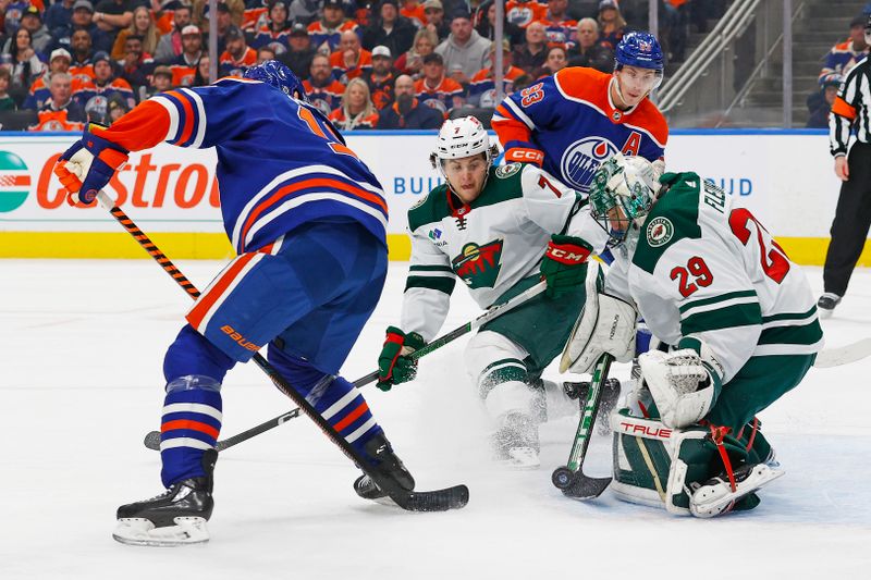 Dec 8, 2023; Edmonton, Alberta, CAN; Minnesota Wild goaltender Marc-Andre Fleury (29) makes a save on a deflection by Edmonton Oilers forward Zach Hyman (18) during the first period at Rogers Place. Mandatory Credit: Perry Nelson-USA TODAY Sports