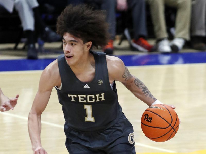 Feb 25, 2025; Pittsburgh, Pennsylvania, USA;  Georgia Tech Yellow Jackets guard Naithan George (1) dribbles against the Pittsburgh Panthers during the second half at the Petersen Events Center. Mandatory Credit: Charles LeClaire-Imagn Images