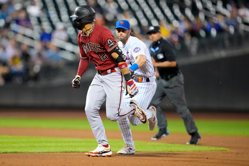 Sep 13, 2023; New York City, New York, USA;New York Mets second baseman Jeff McNeil (1) tags out Arizona Diamondbacks left fielder Lourdes Gurriel Jr. (12) attempting to stretch a single into a double during the fourth inning at Citi Field. Mandatory Credit: Gregory Fisher-USA TODAY Sports