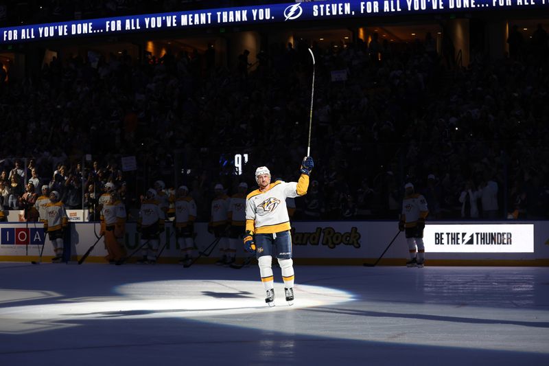 Oct 28, 2024; Tampa, Florida, USA; Nashville Predators center Steven Stamkos (91) is honored during the game against the Tampa Bay Lightning during the first period at Amalie Arena. Mandatory Credit: Kim Klement Neitzel-Imagn Images