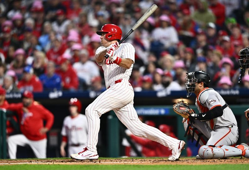 May 5, 2024; Philadelphia, Pennsylvania, USA; Philadelphia Phillies catcher J.T. Realmuto (10) hits a single against the San Francisco Giants in the third inning at Citizens Bank Park. Mandatory Credit: Kyle Ross-USA TODAY Sports