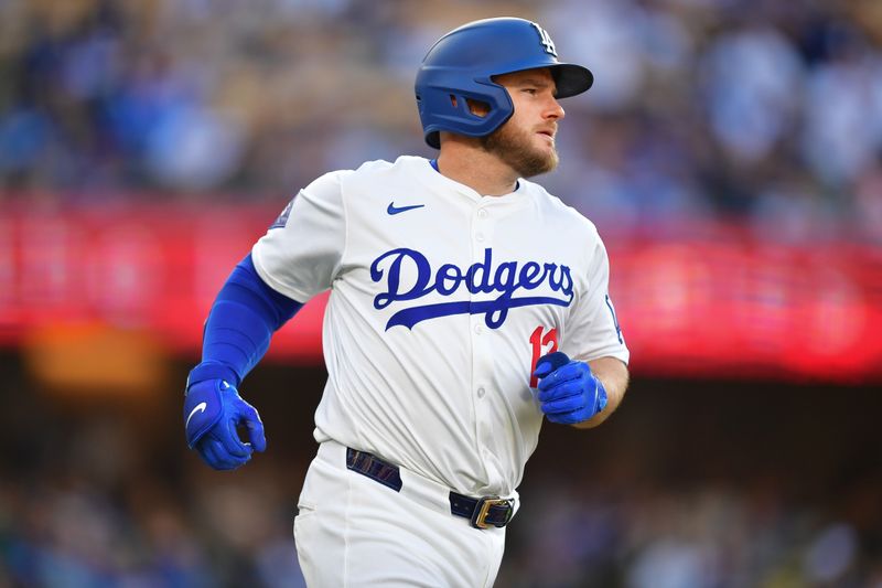 May 4, 2024; Los Angeles, California, USA; Los Angeles Dodgers third baseman Max Muncy (13) runs after hitting a two run home run against the Atlanta Braves during the second inning at Dodger Stadium. Mandatory Credit: Gary A. Vasquez-USA TODAY Sports