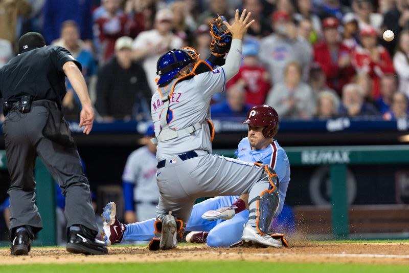 May 16, 2024; Philadelphia, Pennsylvania, USA; Philadelphia Phillies catcher J.T. Realmuto (10) scores past the tag attempt of New York Mets catcher Omar Narváez (2) during the sixth inning at Citizens Bank Park. Mandatory Credit: Bill Streicher-USA TODAY Sports