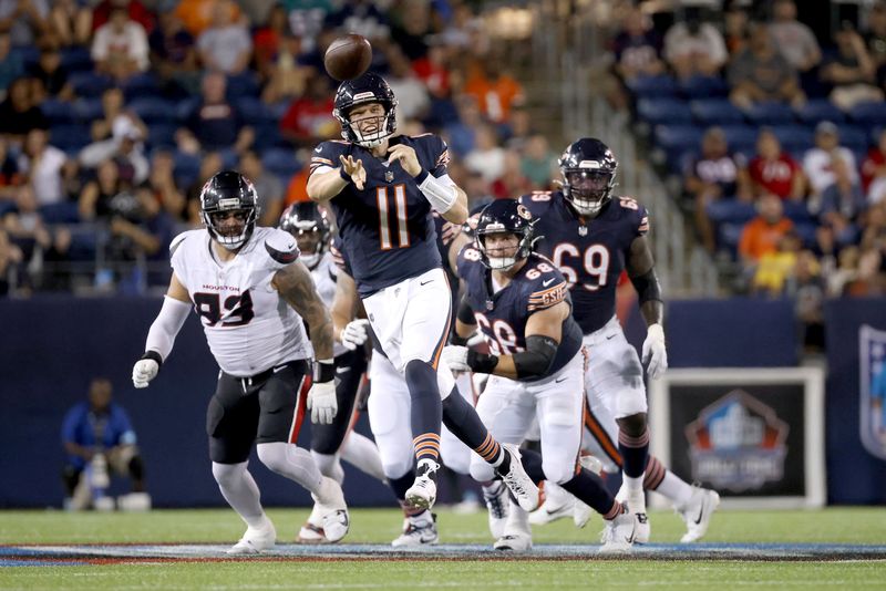 Chicago Bears quarterback Brett Rypien (11) throws the ball during an NFL preseason football game against the Houston Texans, Thursday Aug. 21, 2024, in Canton, Ohio. (AP Photo/Kirk Irwin)