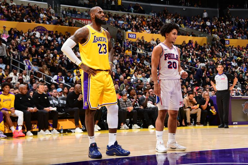 LOS ANGELES, CA - NOVEMBER 8: LeBron James #23 of the Los Angeles Lakers and Jared McCain #20 of the Philadelphia 76ers talk during the game between the Philadelphia 76ers and the Los Angeles Lakers on November 8, 2024 at Crypto.Com Arena in Los Angeles, California. NOTE TO USER: User expressly acknowledges and agrees that, by downloading and/or using this Photograph, user is consenting to the terms and conditions of the Getty Images License Agreement. Mandatory Copyright Notice: Copyright 2024 NBAE (Photo by Adam Pantozzi/NBAE via Getty Images)