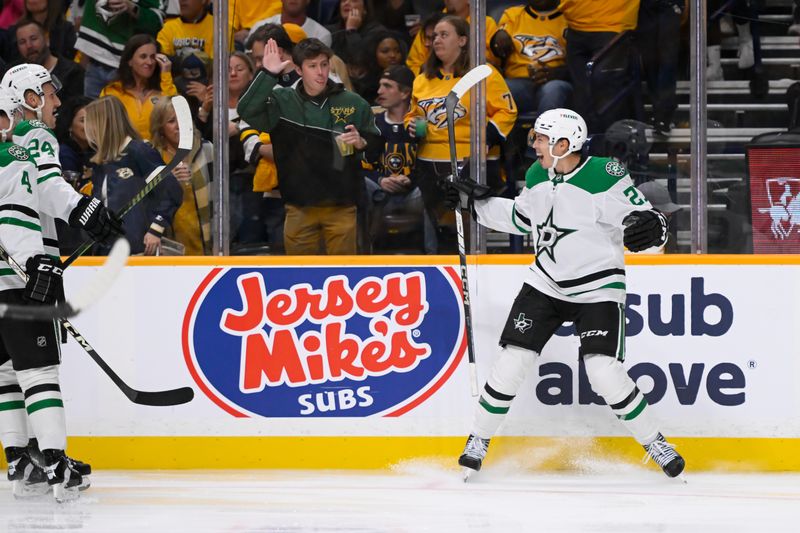 Oct 10, 2024; Nashville, Tennessee, USA;  Dallas Stars left wing Jason Robertson (21) celebrates his goal against the Nashville Predators during the second period at Bridgestone Arena. Mandatory Credit: Steve Roberts-Imagn Images