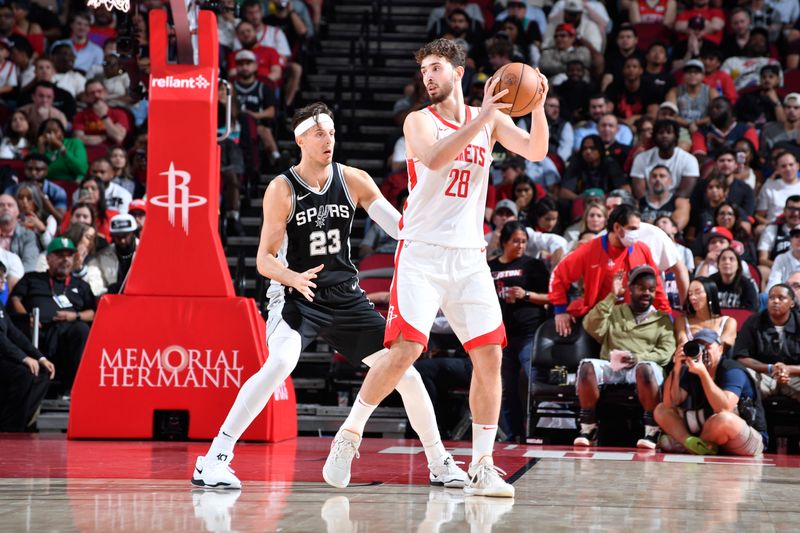 HOUSTON, TX - NOVEMBER 6: Alperen Sengun #28 of the Houston Rockets dribbles the ball during the game against the San Antonio Spurs  on November 6, 2024 at the Toyota Center in Houston, Texas. NOTE TO USER: User expressly acknowledges and agrees that, by downloading and or using this photograph, User is consenting to the terms and conditions of the Getty Images License Agreement. Mandatory Copyright Notice: Copyright 2024 NBAE (Photo by Logan Riely/NBAE via Getty Images)