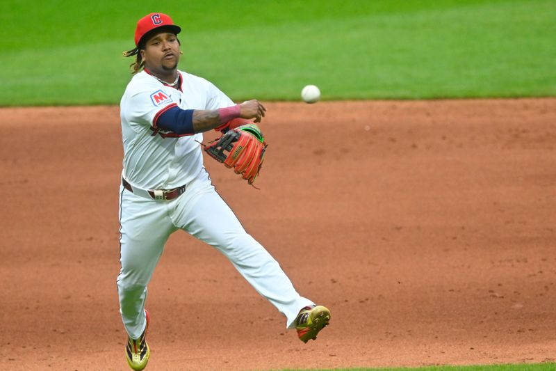 May 13, 2025; Cleveland, Ohio, USA; Cleveland Guardians third baseman Jose Ramirez (11) throws to first base in the sixth inning against the Milwaukee Brewers at Progressive Field. Mandatory Credit: David Richard-Imagn Images