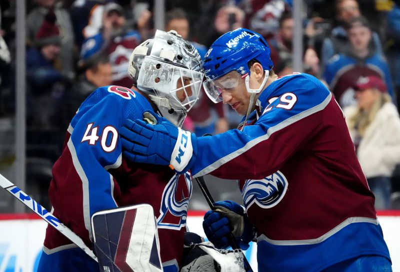 Jan 10, 2024; Denver, Colorado, USA; Colorado Avalanche center Nathan MacKinnon (29) and goaltender Alexandar Georgiev (40) celebrate defeating the Vegas Golden Knights at Ball Arena. Mandatory Credit: Ron Chenoy-USA TODAY Sports