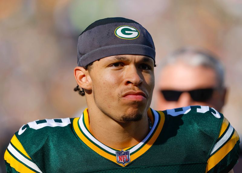 Green Bay Packers wide receiver Christian Watson (9) on the sidelines during an NFL football game Sunday, Oct. 2, 2022, in Green Bay, Wis. (AP Photo/Jeffrey Phelps)