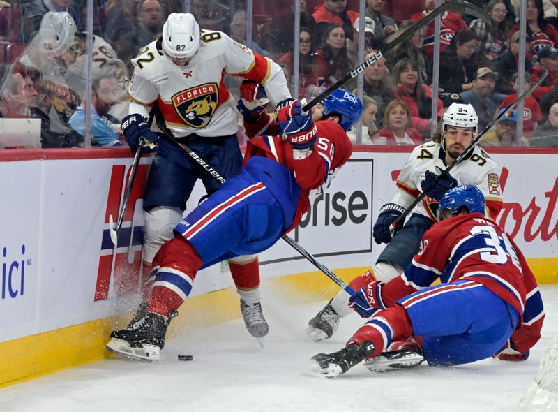 Apr 2, 2024; Montreal, Quebec, CAN; Florida Panthers forward Kevin Stenlund (82) checks Montreal Canadiens defenseman David Savard (58) during the first period at the Bell Centre. Mandatory Credit: Eric Bolte-USA TODAY Sports