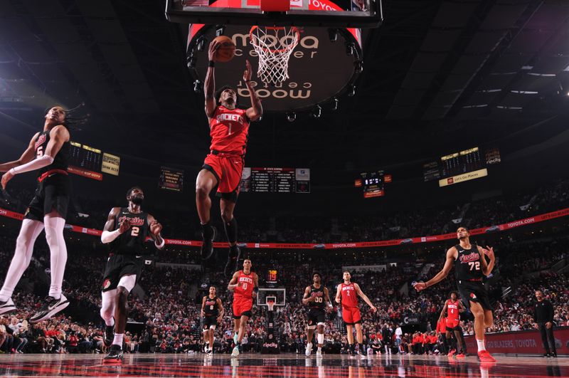 PORTLAND, OR - APRIL 12: Amen Thompson #1 of the Houston Rockets drives to the basket during the game against the Portland Trail Blazers on April 12, 2024 at the Moda Center Arena in Portland, Oregon. NOTE TO USER: User expressly acknowledges and agrees that, by downloading and or using this photograph, user is consenting to the terms and conditions of the Getty Images License Agreement. Mandatory Copyright Notice: Copyright 2024 NBAE (Photo by Cameron Browne/NBAE via Getty Images)