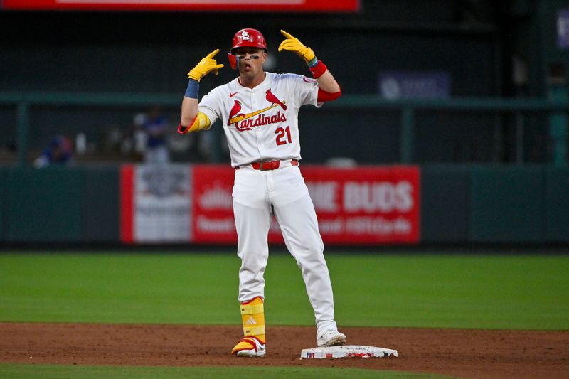 Jul 30, 2024; St. Louis, Missouri, USA;  St. Louis Cardinals right fielder Lars Nootbaar (21) reacts after hitting a one run double against the Texas Rangers during the third inning at Busch Stadium. Mandatory Credit: Jeff Curry-USA TODAY Sports