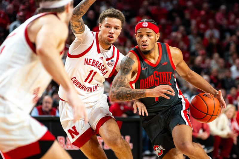 Jan 23, 2024; Lincoln, Nebraska, USA; Ohio State Buckeyes guard Roddy Gayle Jr. (1) drives against Nebraska Cornhuskers guard Eli Rice (11) during the second half at Pinnacle Bank Arena. Mandatory Credit: Dylan Widger-USA TODAY Sports