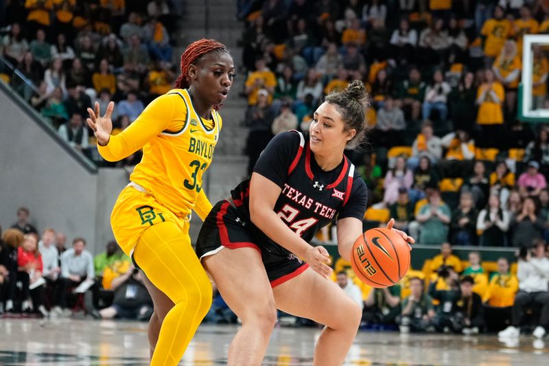 Feb 18, 2024; Waco, Texas, USA;  Texas Tech Red Raiders guard Jada Wynn (24) looks to pass against Baylor Lady Bears guard Aijha Blackwell (33) during the first half at Paul and Alejandra Foster Pavilion. Mandatory Credit: Chris Jones-USA TODAY Sports

