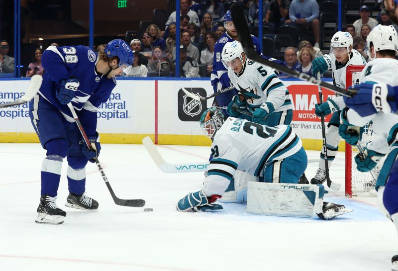 Oct 26, 2023; Tampa, Florida, USA; Tampa Bay Lightning left wing Brandon Hagel (38) shoots as San Jose Sharks goaltender Mackenzie Blackwood (29) defends during the first period at Amalie Arena. Mandatory Credit: Kim Klement Neitzel-USA TODAY Sports