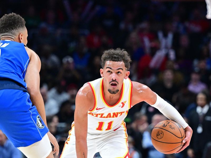 ATLANTA, GA - JANUARY 26: Trae Young #11 of the Atlanta Hawks looks on during the game against the Dallas Mavericks on January 26, 2024 at State Farm Arena in Atlanta, Georgia.  NOTE TO USER: User expressly acknowledges and agrees that, by downloading and/or using this Photograph, user is consenting to the terms and conditions of the Getty Images License Agreement. Mandatory Copyright Notice: Copyright 2024 NBAE (Photo by Adam Hagy/NBAE via Getty Images)