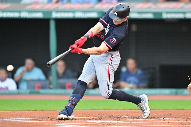 Sep 5, 2023; Cleveland, Ohio, USA; Minnesota Twins right fielder Max Kepler (26) hits an RBI double during the first inning against the Cleveland Guardians at Progressive Field. Mandatory Credit: Ken Blaze-USA TODAY Sports