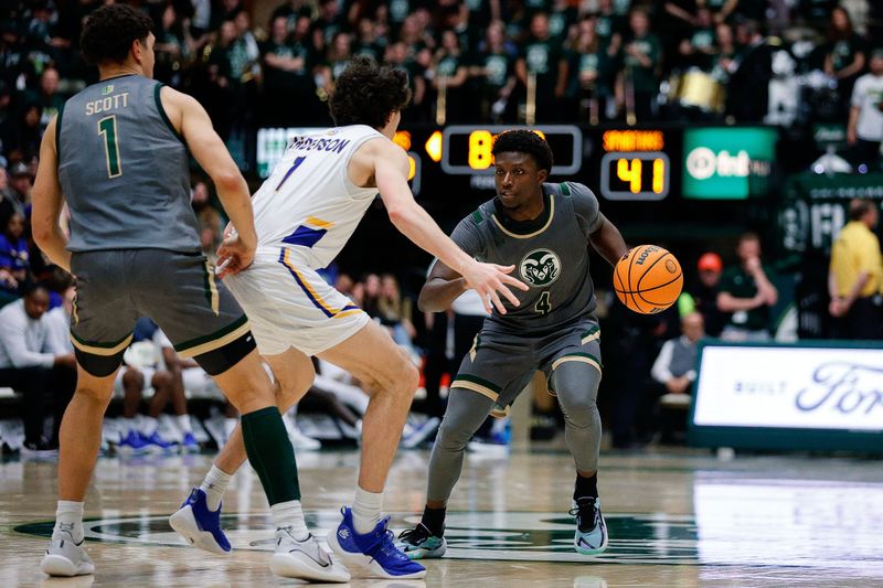 Feb 9, 2024; Fort Collins, Colorado, USA; Colorado State Rams guard Isaiah Stevens (4) controls the ball against San Jose State Spartans guard Garrett Anderson (1) as forward Joel Scott (1) screens in the second half at Moby Arena. Mandatory Credit: Isaiah J. Downing-USA TODAY Sports