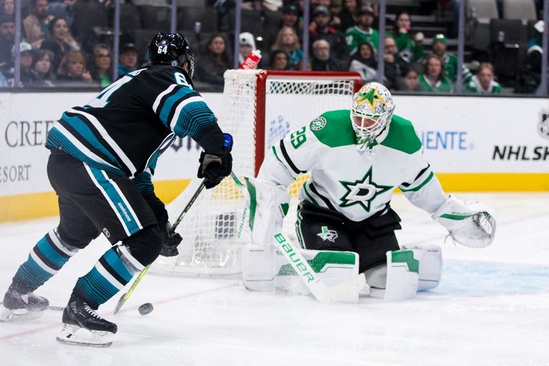 Mar 5, 2024; San Jose, California, USA; Dallas Stars goaltender Jake Oettinger (29) defends against a shot by San Jose Sharks center Mikael Granlund (64) during the second period at SAP Center at San Jose. Mandatory Credit: John Hefti-USA TODAY Sports