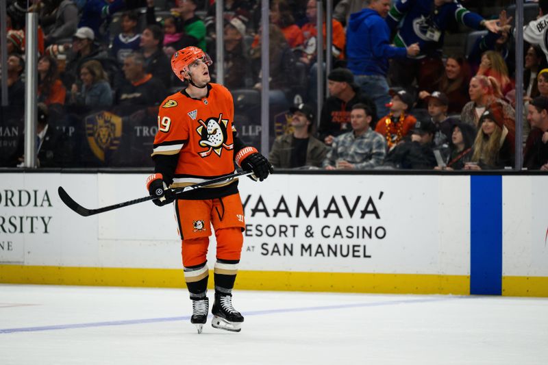 Nov 26, 2025; Anaheim, California, USA; Anaheim Ducks right wing Troy Terry (19) looks on after the Vancouver Canucks score during the second period at Honda Center. Mandatory Credit: William Liang-Imagn Images